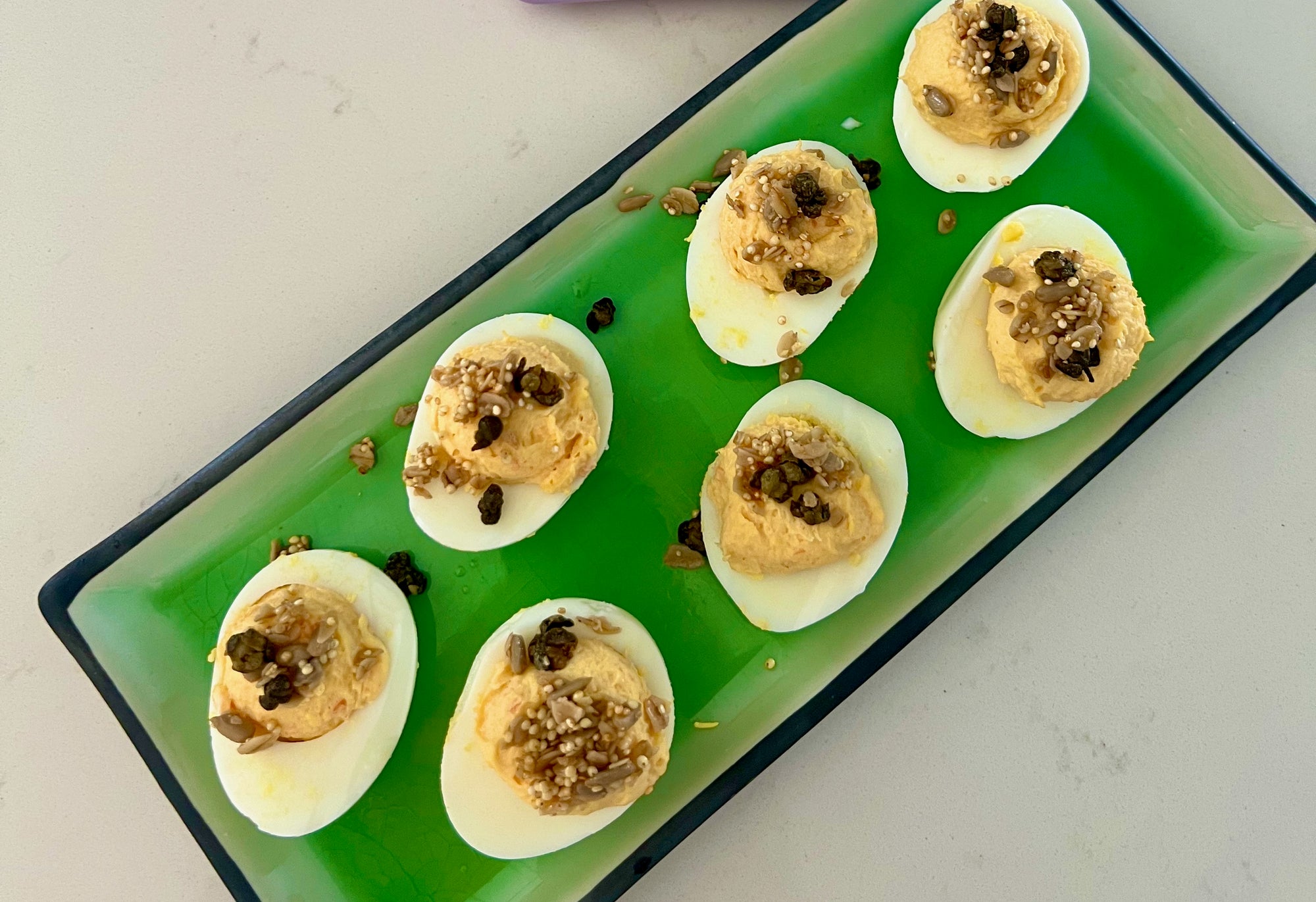 Smoked Salmon Deviled Eggs with Crispy Caper Over the Top